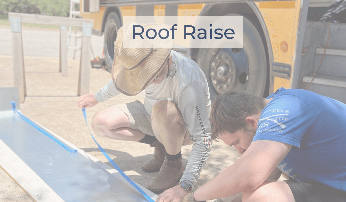 Richard and Henry work on skoolie roof raise